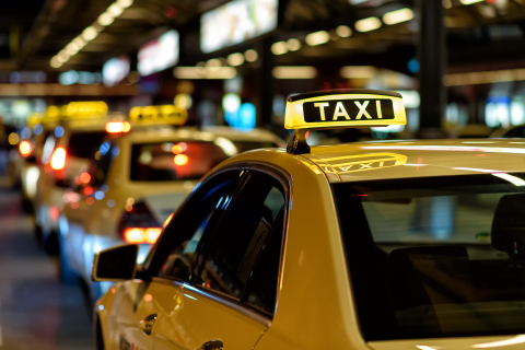 A taxi in the city at night