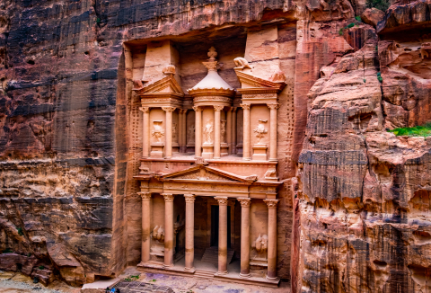 A camel resting in front of the Treasury in Petra